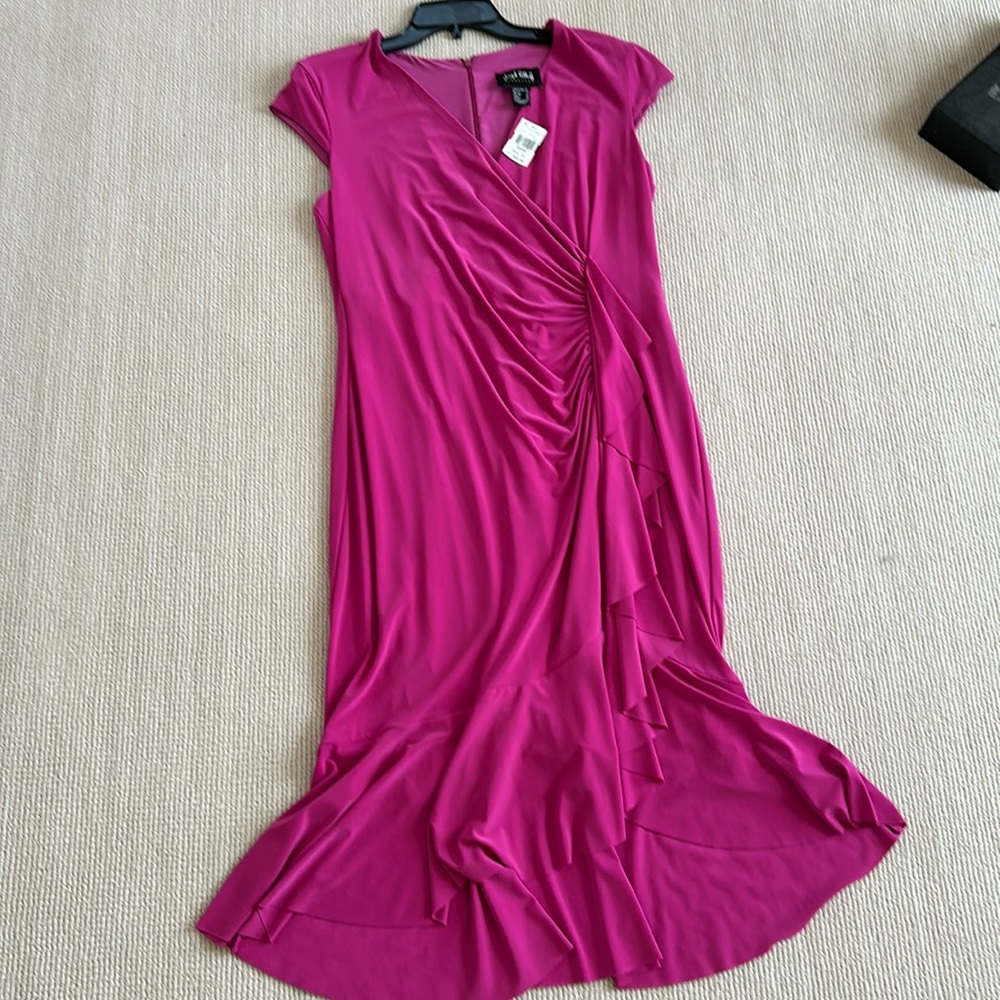 Dress hangs great.  Never worn.  Ruffles in front and bottom